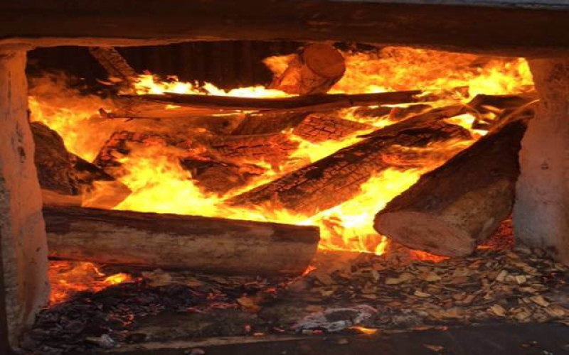 Wood burning in wood fired boiler